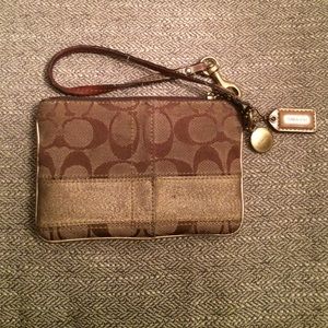 Authentic Coach Wristlet gold stripe