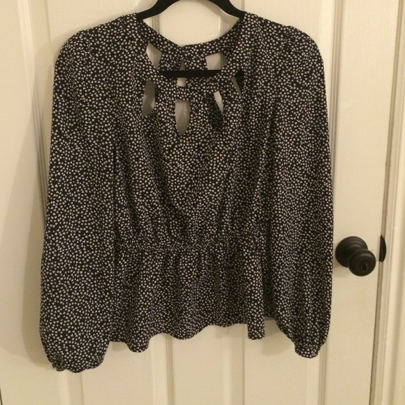 Peplum heart blouse with cut out detail.