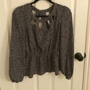 Peplum heart blouse with cut out detail.