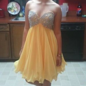 short yellow dress with rhinestone top