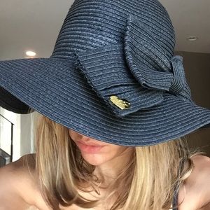 Betsey Johnson black floppy beach hat with bow.
