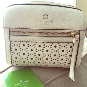 White eyelet Kate Spade messenger bag