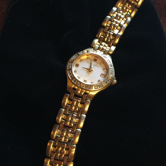 Yves Saint Laurent Accessories - TRADED YSL GOLD MOTHER OF PEARL FACE DIAL SAPPHIRE
