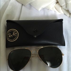 Brand new Ray Bans with case, cloth, and book