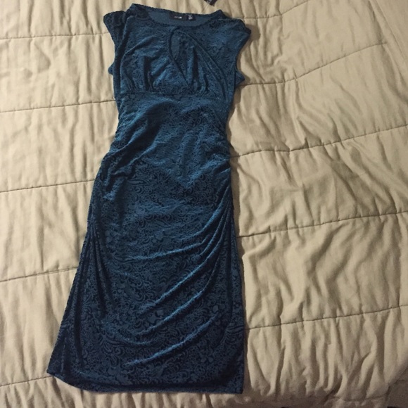 Dark teal velvet dress with a peek-a-boo neckline