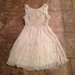 Cream dress with pleather top and ruffled skirt