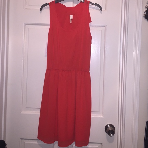 Red chiffon dress with ruffled bow in back