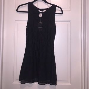 Black sleeveless, ruffled top