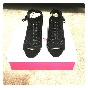 Black laser cut out stacked heel booties