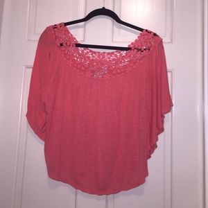 Salmon colored top with lace near neckline