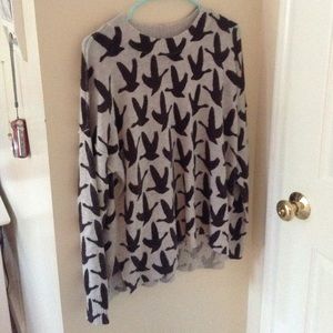 Women's sweater with geese flying on it