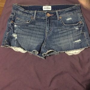 Shorts with lace under pockets