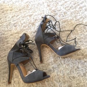 Gray faux suede lace up heels.