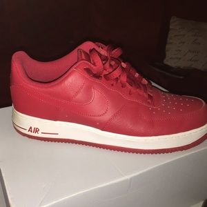 Red and white Mens Air Force ones worn 3xs