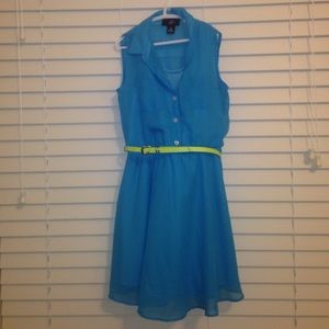 blue flowy dress with neon yellow belt