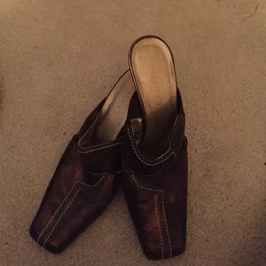 Meuccl metallic mules.