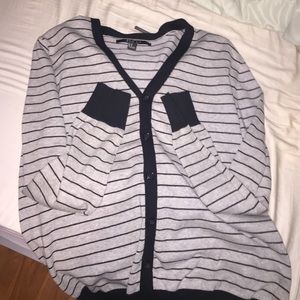 Gray/white cardigan with thin black stripes.