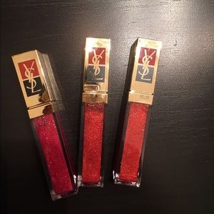 Set of 3 YSL lip glosses.