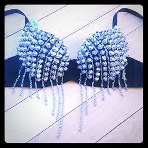 Metal studded black bra with chain detail.