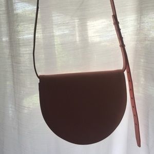 Crescent shaped pastel pink purse