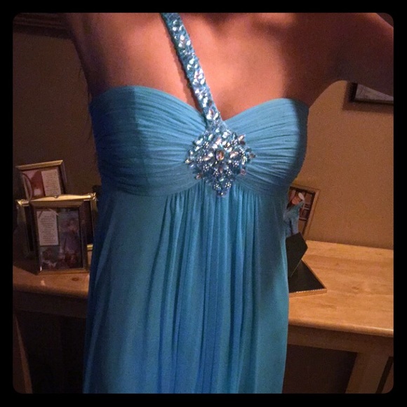 Beautifully beaded teal prom dress