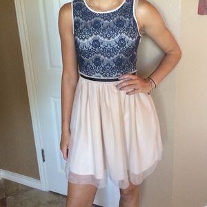 Cream and navy with black belt, size small.