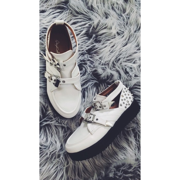 White buckle boots with studs