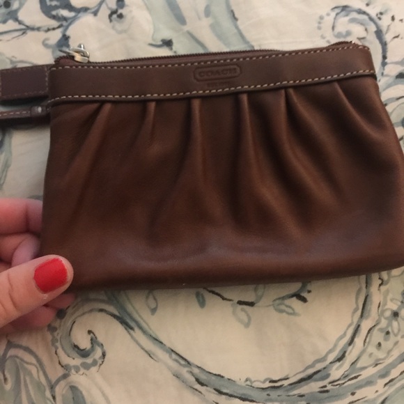 Brown leather coach wristlet