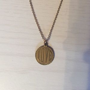 Burnished gold "love" pendant necklace