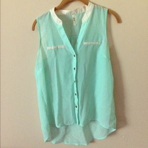 Turquoise and white sleeveless blouse