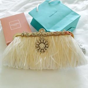 Gorgeous ivory bridal clutch with feathers