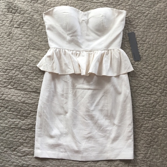 Aryn K Pep It Up Strapless Ivory Peplum Dress