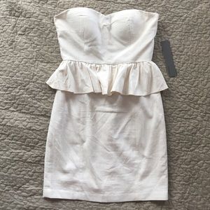 Aryn K Pep It Up Strapless Ivory Peplum Dress