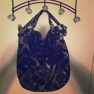 Used black and silver coach purse