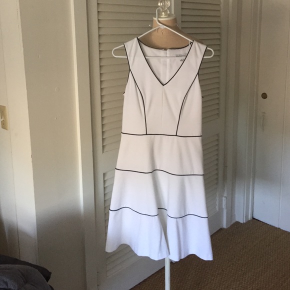 White Banana Republic flared dress with navy trim.