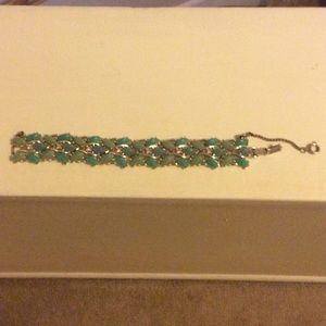 Teal stoned clip over bracelet