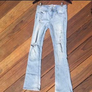 Light wash destroyed denim jeans