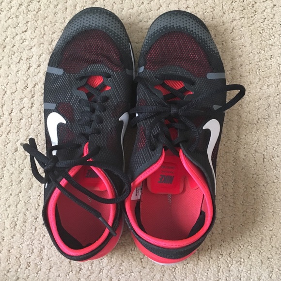 Black and neon orange Nikes