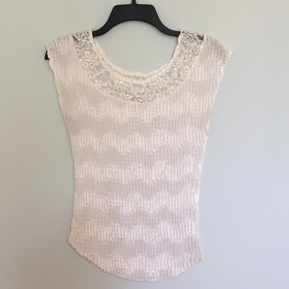 Cream sleeveless blouse