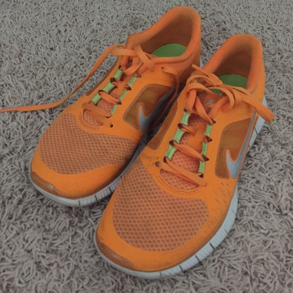 Orange nike free runs