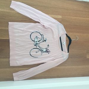 Light pink sweater with bicycle design