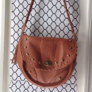 Bohemian style brown bag with tassles.