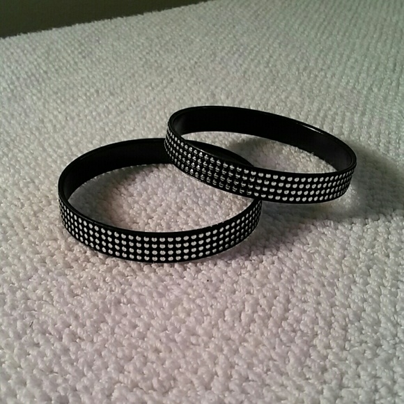 Two black and silver bracelets