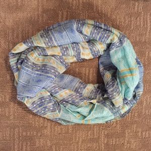 Teal and blue patterned infinity scarf.