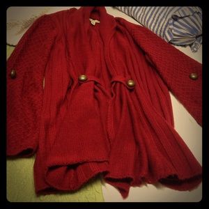 Rust colored shawl sweater with gold detailing