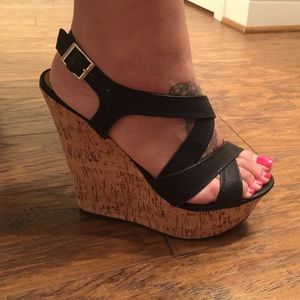 Black wedges with wooden platform.
