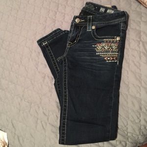 Dark wash miss me jeans.