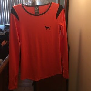 Orange long sleeve workout shirt.