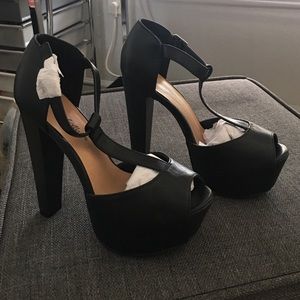 Never worn new black on black platforms