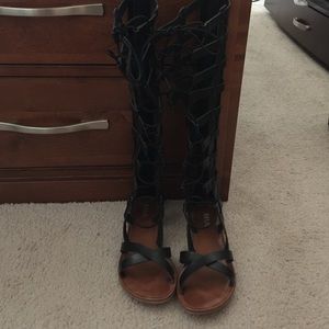 Black leather gladiator sandals